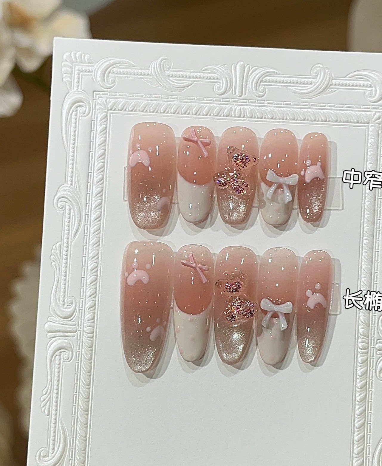 Reference image comparing medium oval and long oval handmade pink press-on nail shapes