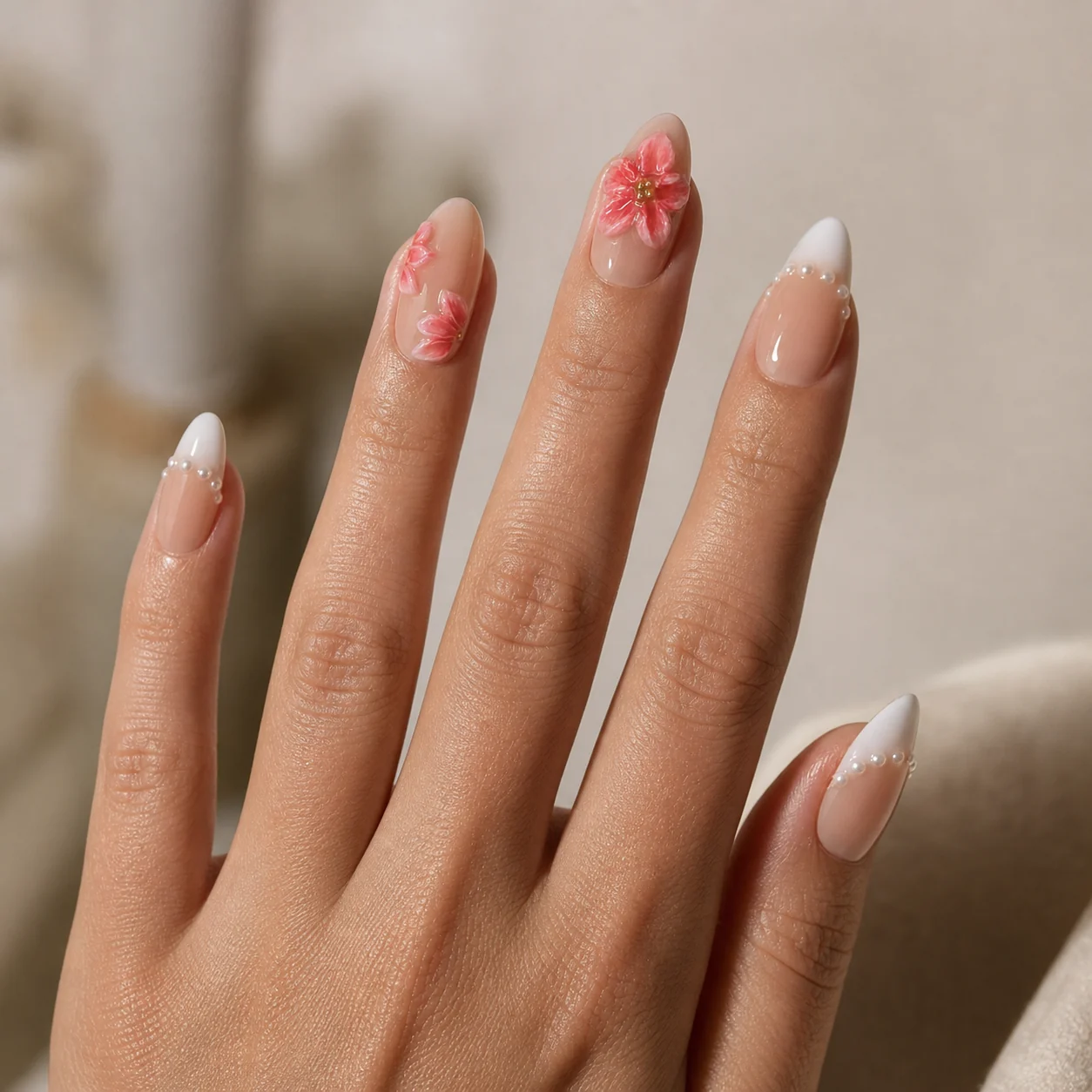 Model wearing Blush Floral French press-on nails, long almond