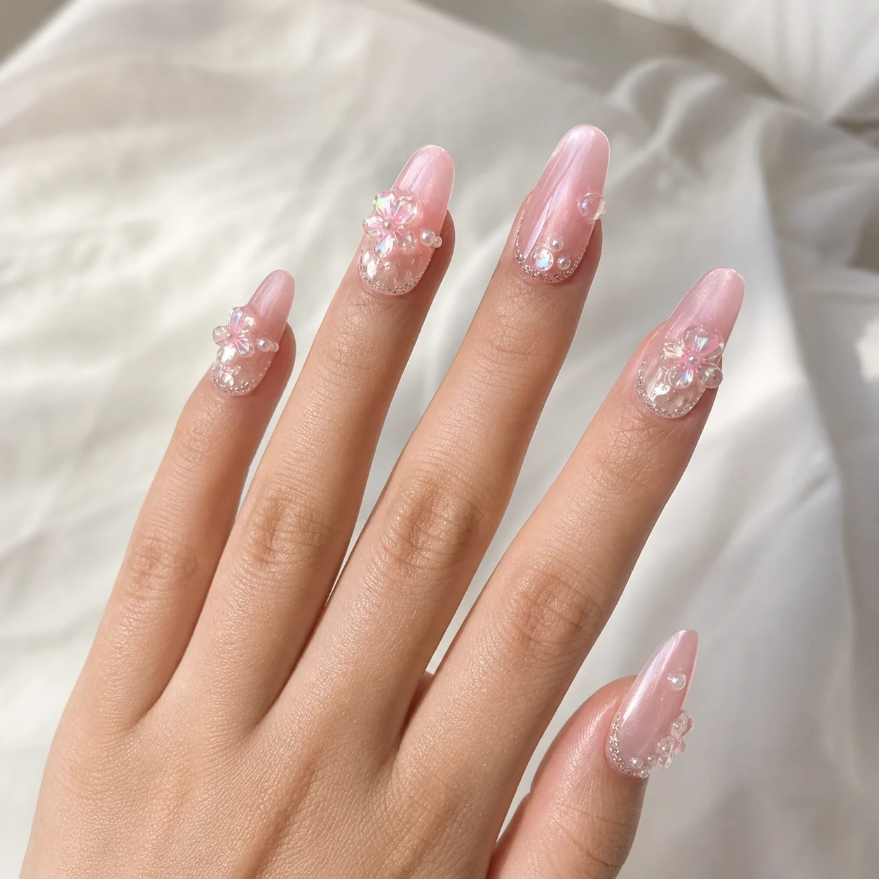 Model wearing Pink Cat Eye Flame press-on nails, long stiletto