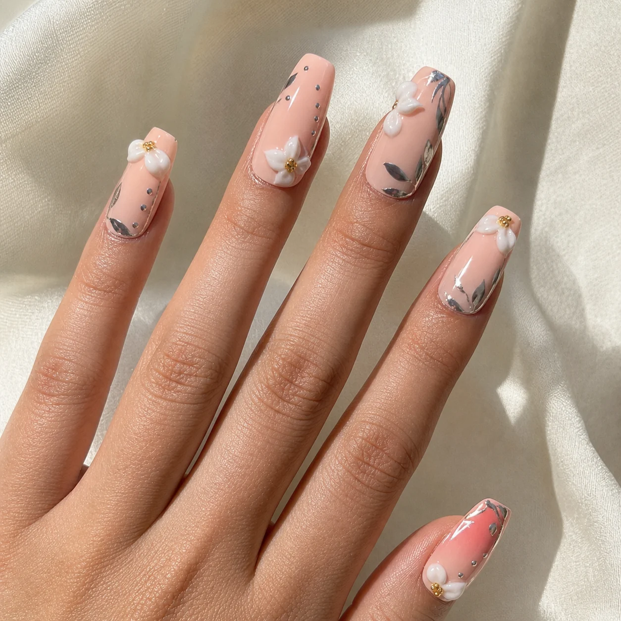 Model wearing Soft Pink Ribbon press-on nails, long coffin